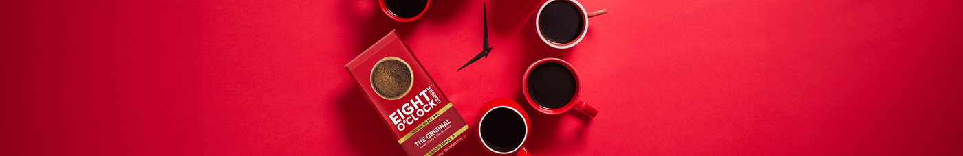 Eight O'clock coffee in coffee mugs with a bag of coffee bean shaped like a clock.